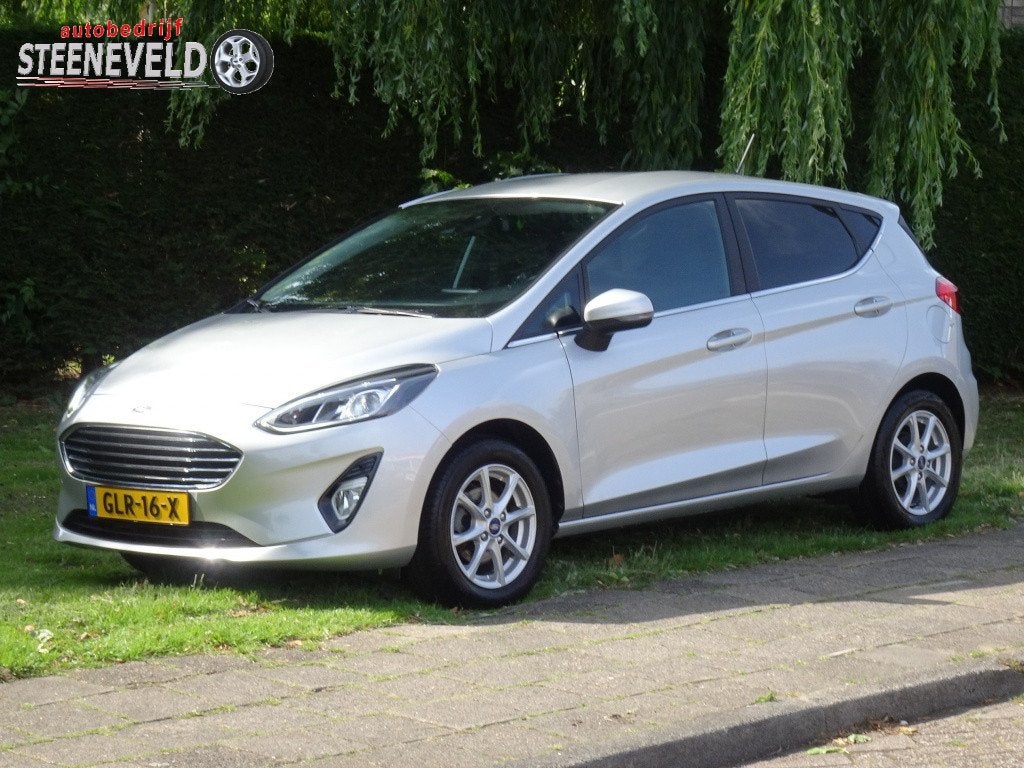 Ford Fiesta 1.0 100pk Titanium met CarPlay en Parkeersensore, Keurmerk '100% Onderhouden', Automatische klimaatregeling, Gebruikt