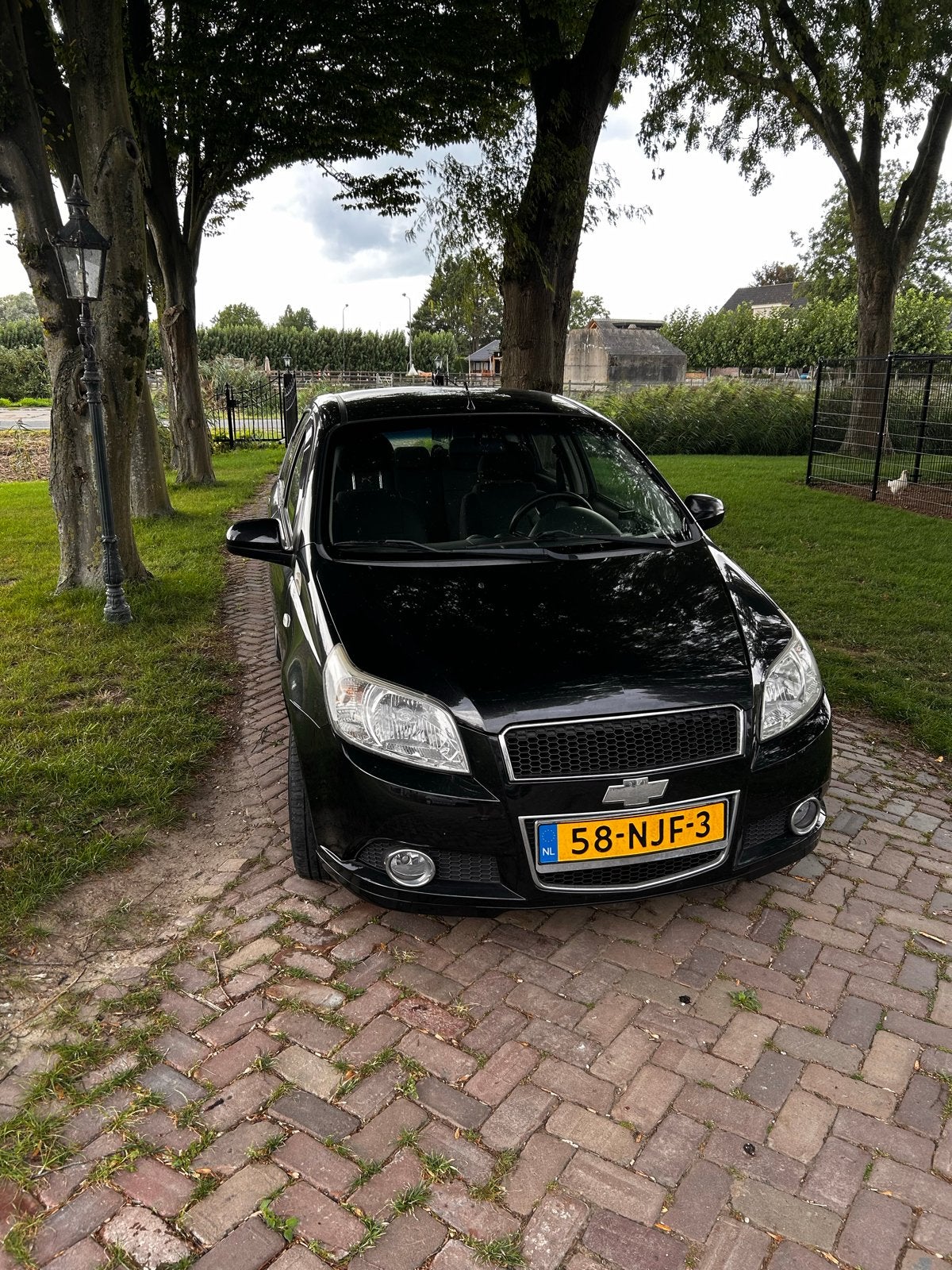 Chevrolet Aveo 1.2 16V 5D 2010 Zwart, Auto's, Voorwielaandrijving, 40 €/maand, Aveo, 4 cilinders