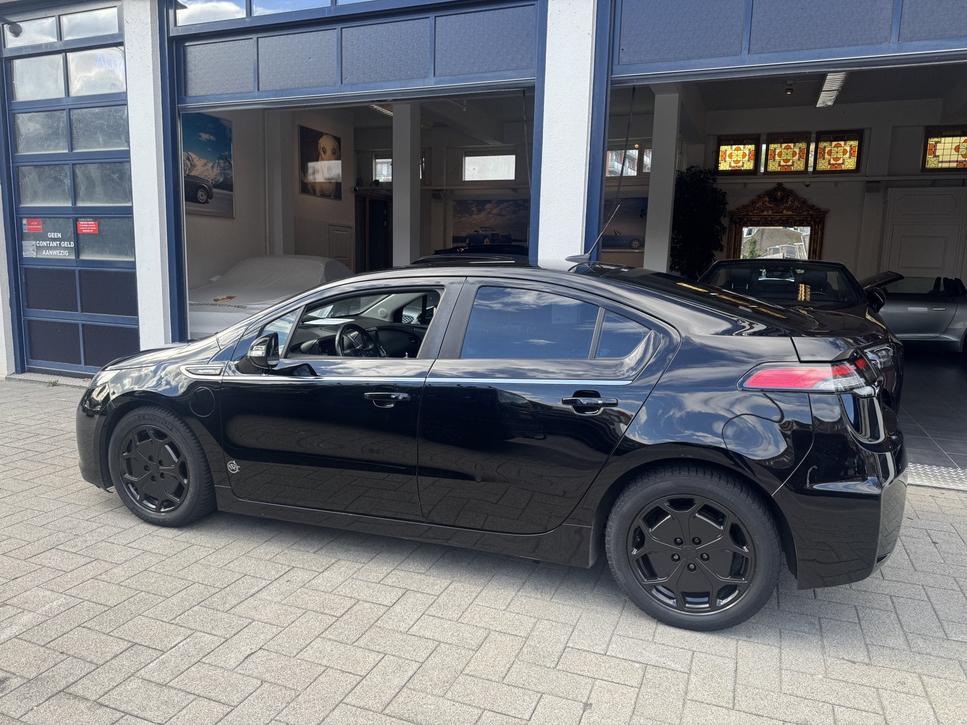 Opel Ampera 1.4 NL AUTO/LEDER/CLIMA/CAMERA/BOSE (bj 2013), Auto's, Euro 5, 1398 cc, 4 cilinders, 4 stoelen
