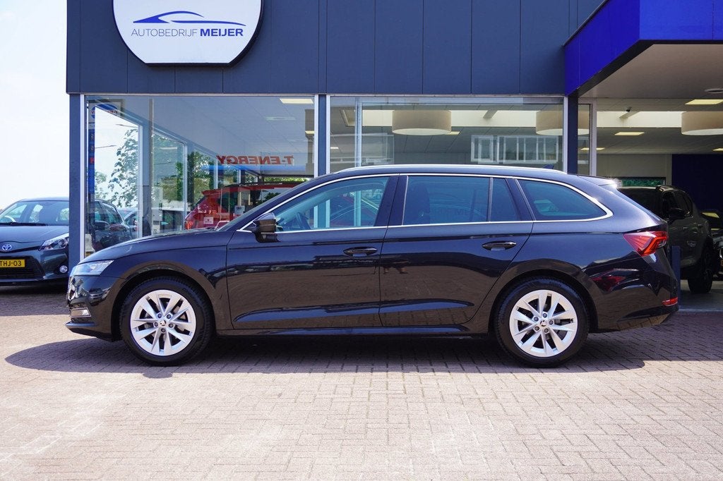 Skoda Octavia Combi 1.0 e-TSI Business Edition Plus Automaat, Auto's, Skoda, Stof, Gebruikt, Hybride Elektrisch/Benzine, 3 cilinders