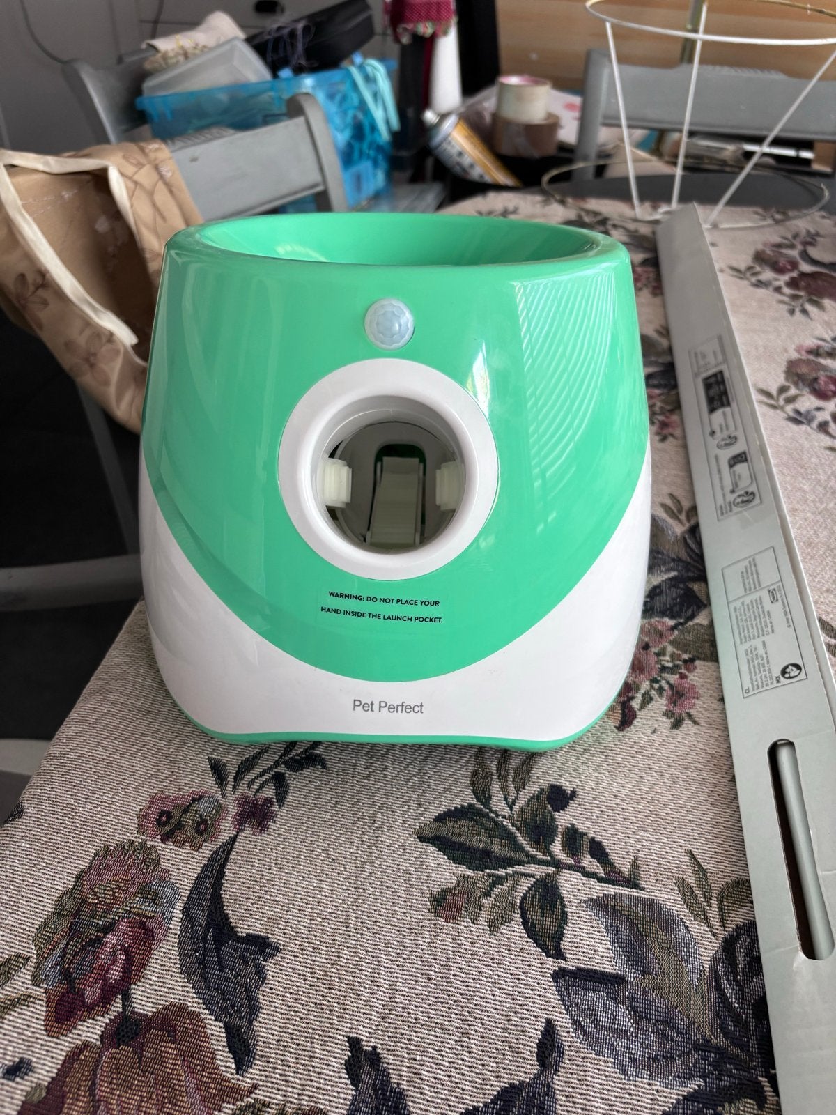 Pet Perfect balgooimachine, Ophalen