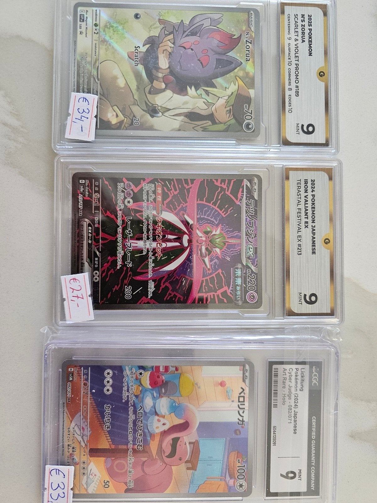 Graded Pokémon Kaarten (N's Zorua, Iron Valiant EX, Lickit, Ophalen of Verzenden, Zo goed als nieuw, Meerdere kaarten, Foil