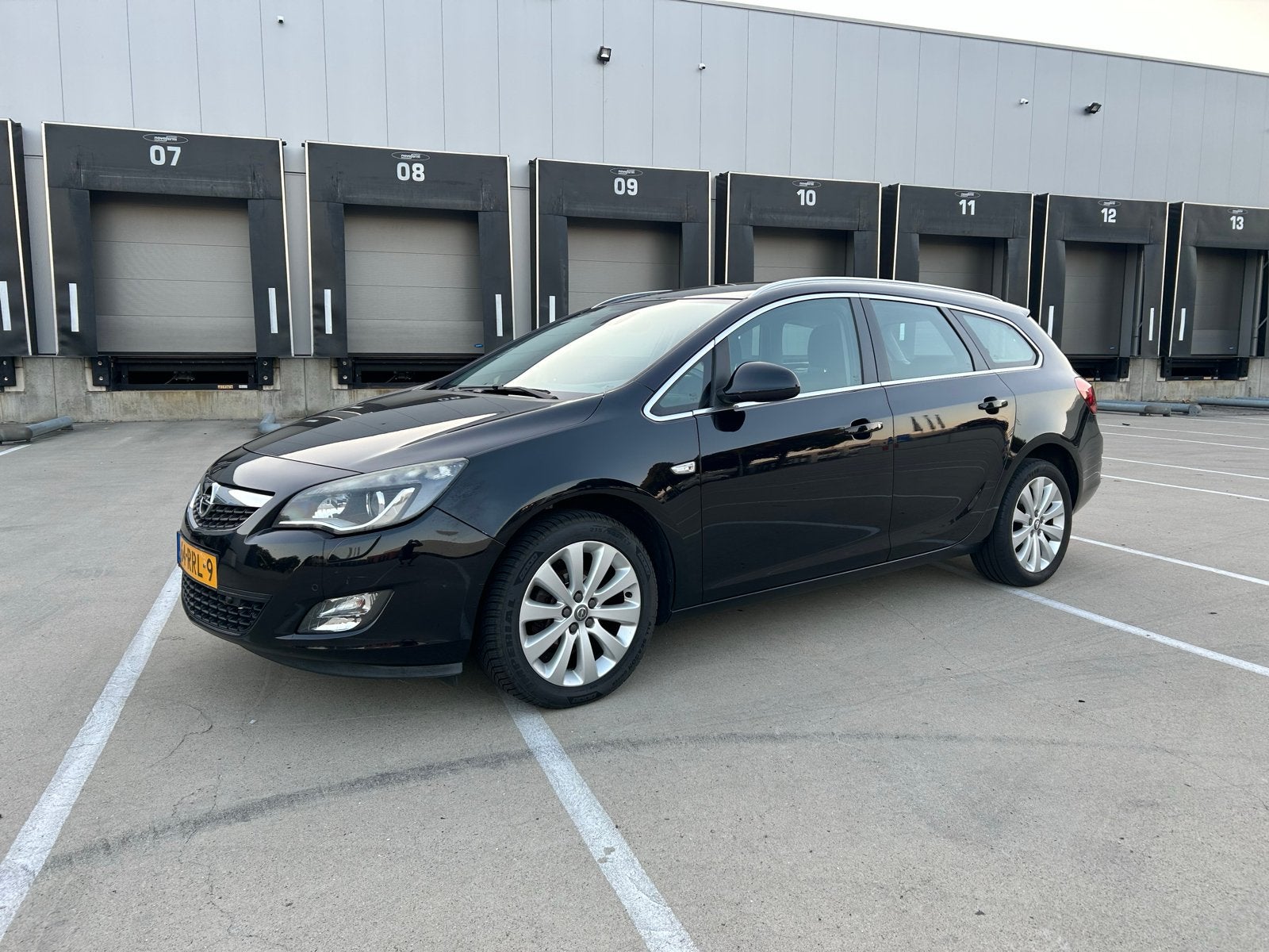 Opel Astra 1.4 Turbo 140 pk Sp.tourer AUT 2011 Zwart, Auto's, 15 km/l, Zwart, 4 cilinders, Leder en Stof
