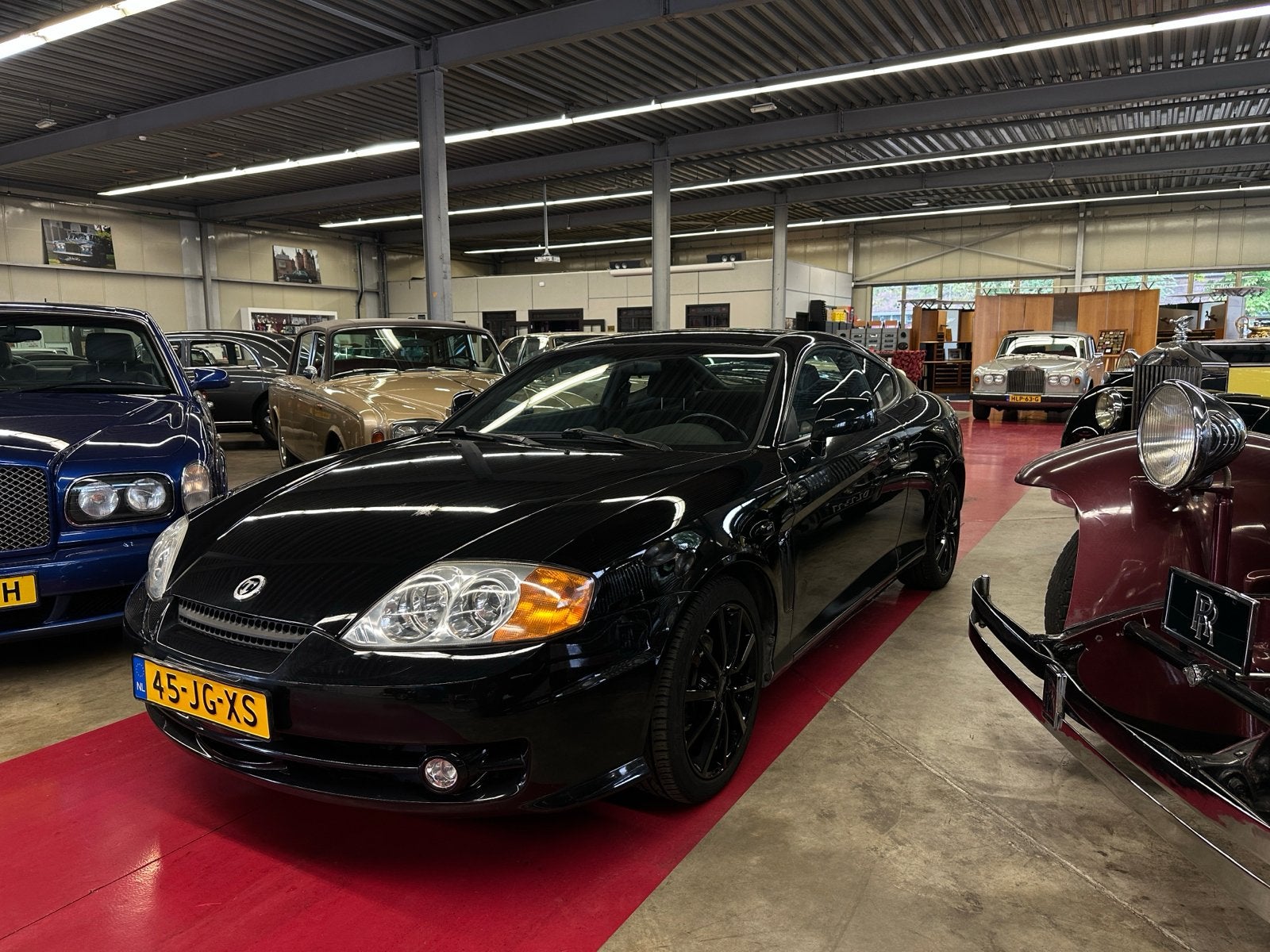 Hyundai Coupé 2.0 2002 Zwart, Auto's, Voorwielaandrijving, 4 stoelen, 138 pk, Zwart