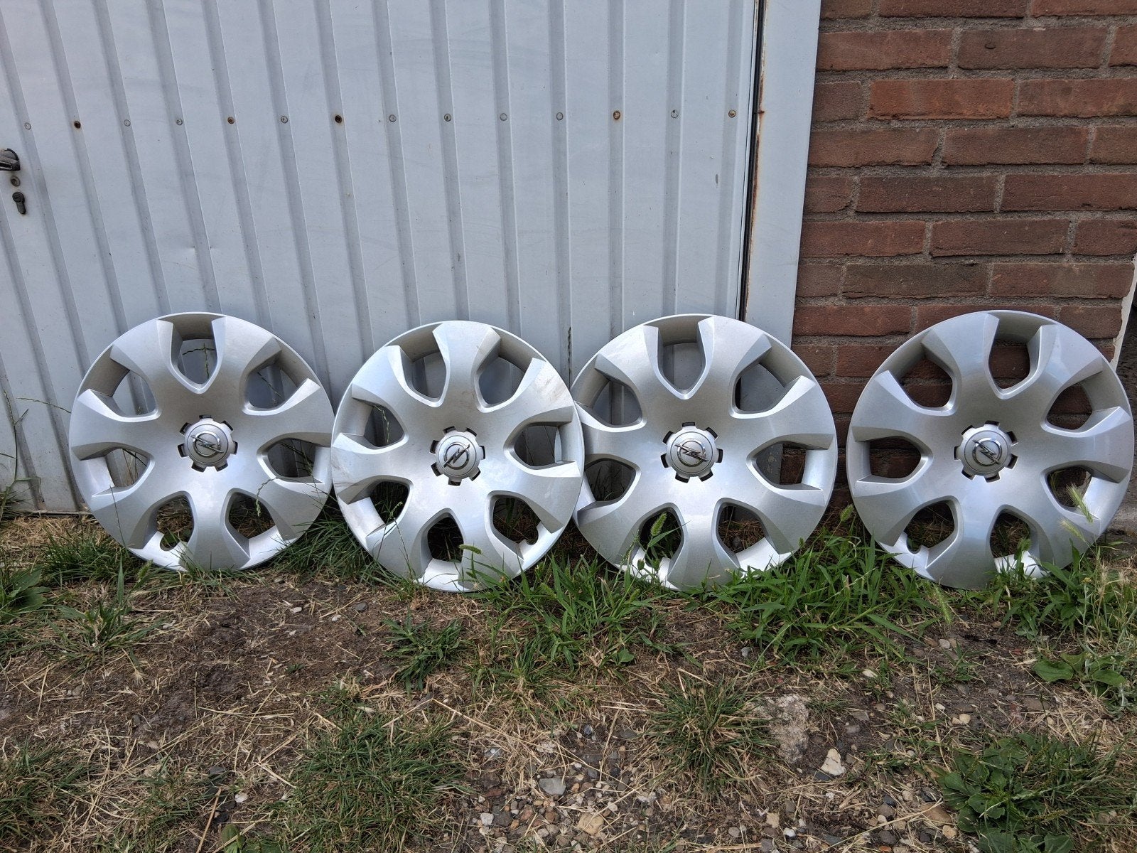 Set van 4 originele 16 inch Opel wieldoppen, Ophalen, Gebruikt