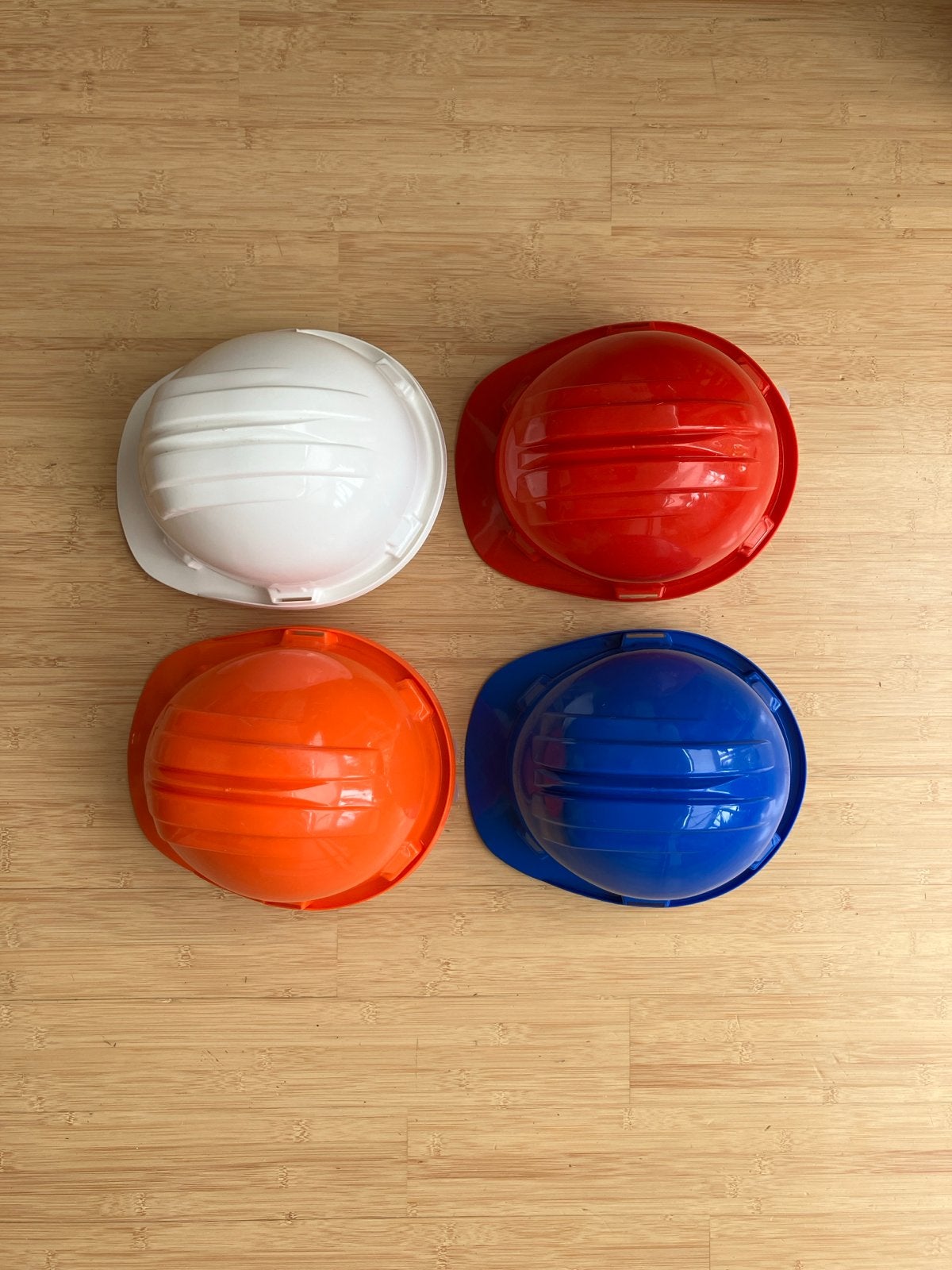 Set van 4 bouwhelmen in verschillende kleuren, Ophalen of Verzenden, Zo goed als nieuw