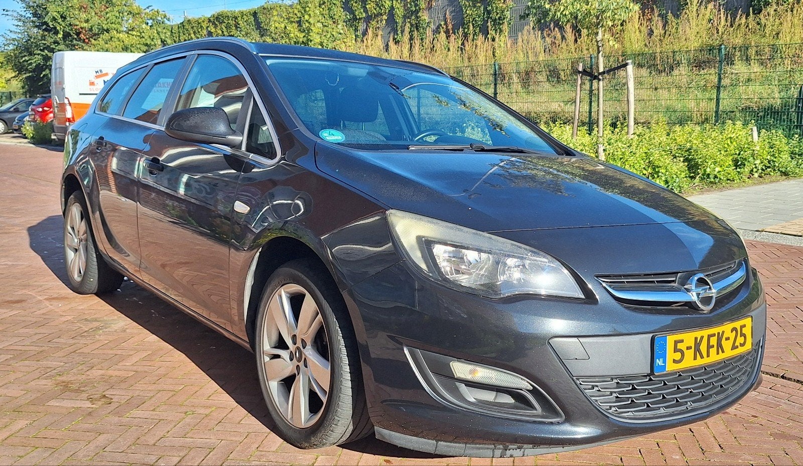 Opel Astra 1.4 Turbo 88KW Sports Tourer 2013 Zwart, Auto's, Voorwielaandrijving, Stof, Zwart, 4 cilinders