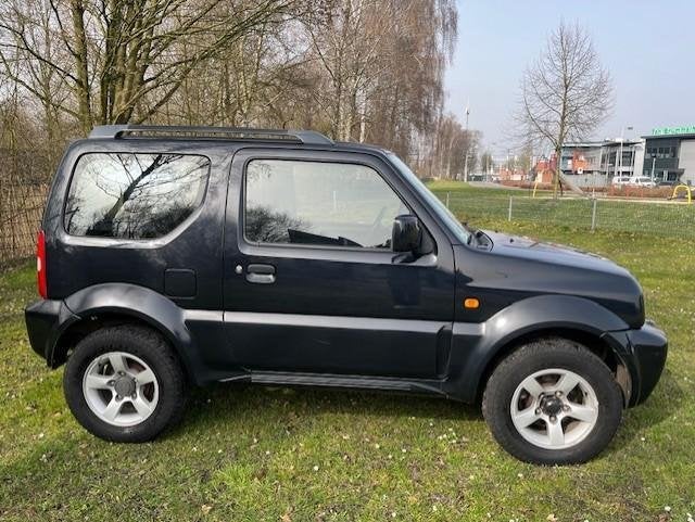 Suzuki Jimny 1.3 JLX AIRCO/4XWD/NIEUWE APK!/155DKM/NETTE AUT, Auto's, Euro 5, Gebruikt, 4 stoelen, Zwart
