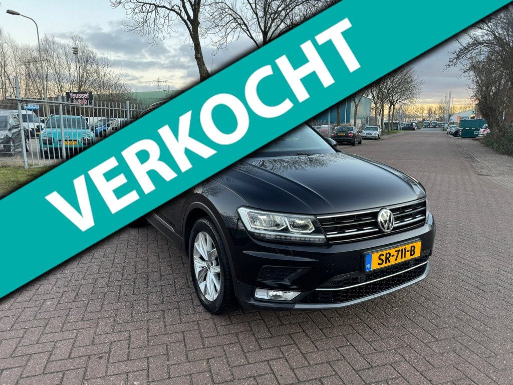 Volkswagen Tiguan 2.0 TDI Highline automaat prijs ex bpm, Gebruikt, Euro 6, 4 cilinders, Zwart