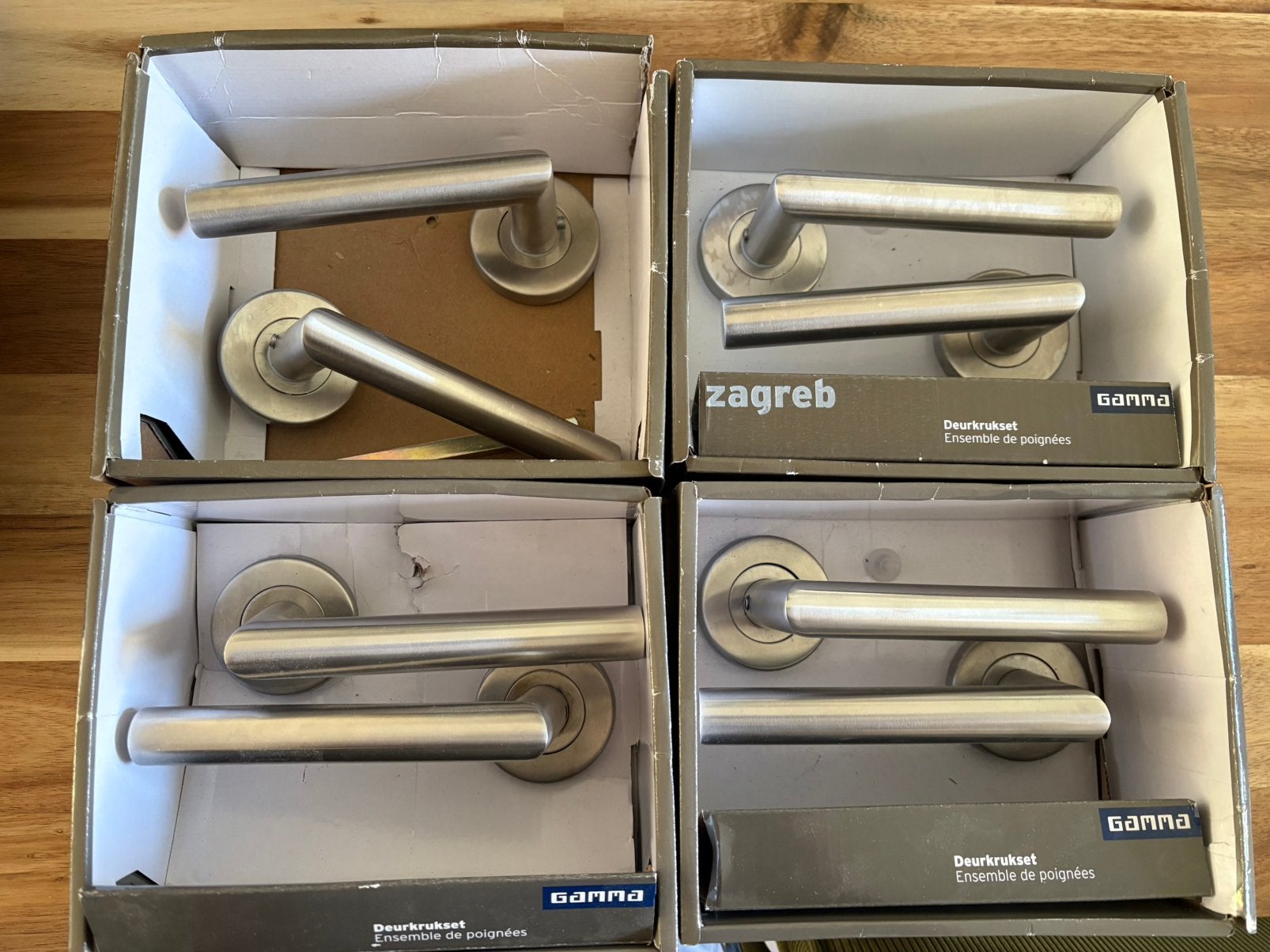 Deurkruk Gamma RVS op rozet (4 sets), Ophalen, Rvs, Klink of Kruk