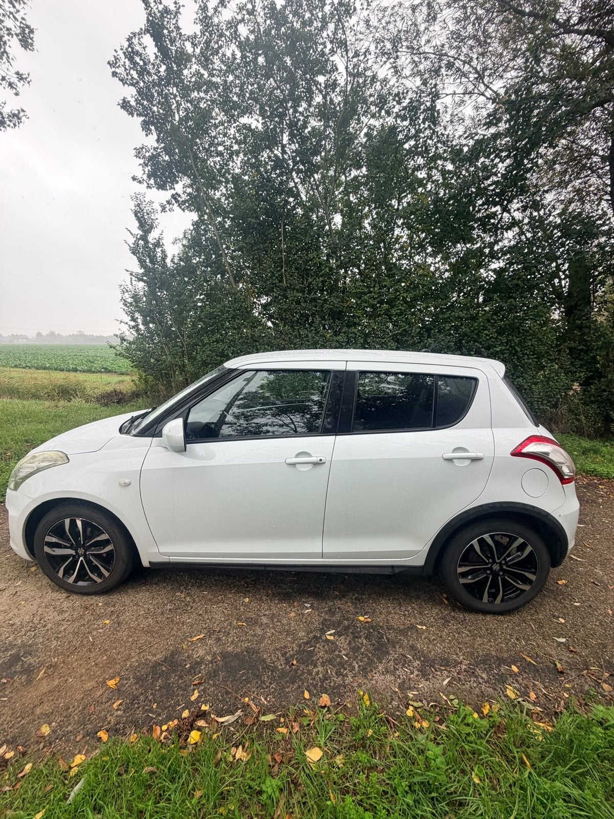 Suzuki Swift 1.2 Style EASS 2015 parelmoer wit, Auto's, 400 kg, Alcantara, Origineel Nederlands, Handgeschakeld