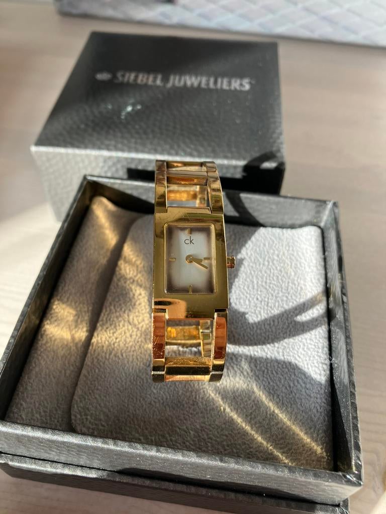 Calvin Klein, goudkleurig horloge, Sieraden, Tassen en Uiterlijk, Horloges | Dames, Ophalen of Verzenden, Zo goed als nieuw, Staal