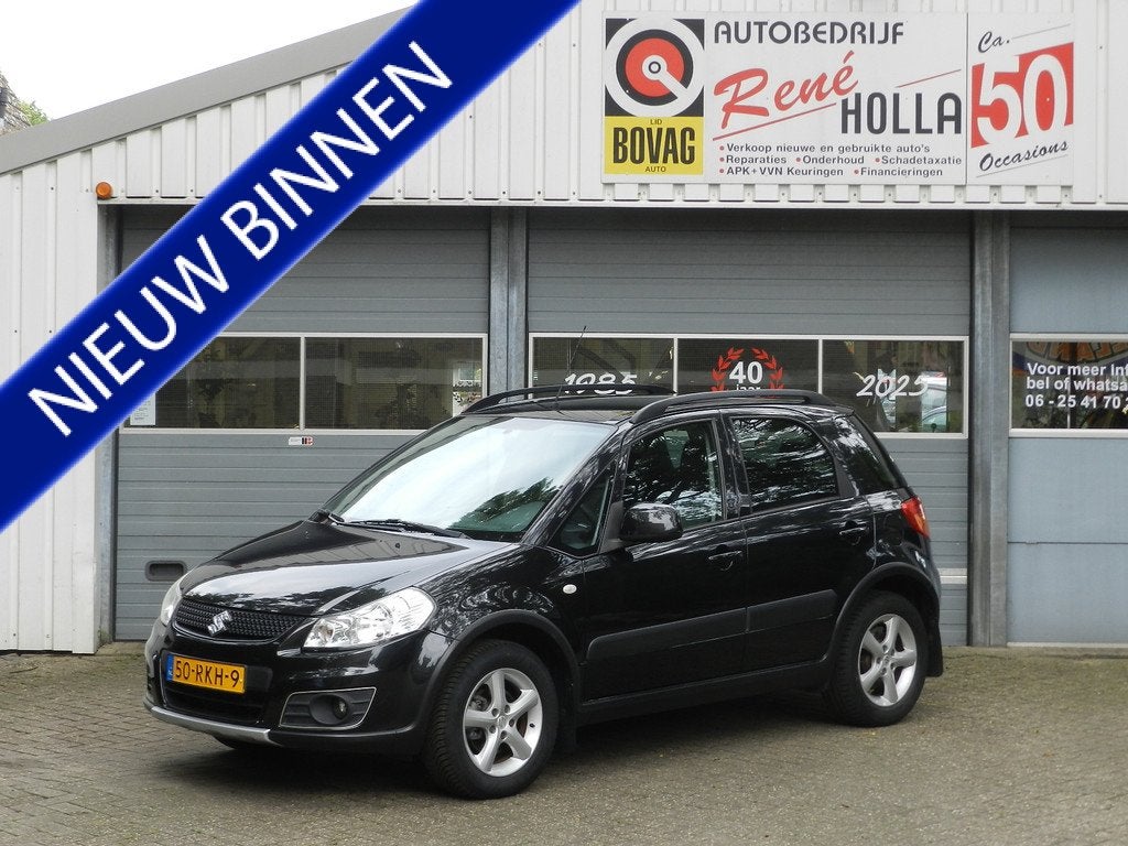 Suzuki SX4 1.6 AWD 4X4 Comfort 5Drs Airco Navigatie LMV Alca, Euro 5, Gebruikt, Zwart, 4 cilinders