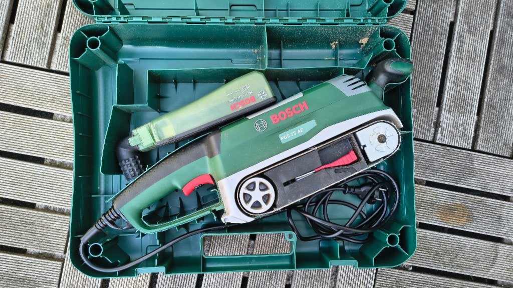 Bosch PBS 76 AE bandschuurmachine, Doe-het-zelf en Verbouw, Gereedschap | Schuurmachines, Ophalen, Gebruikt, 600 tot 1200 watt