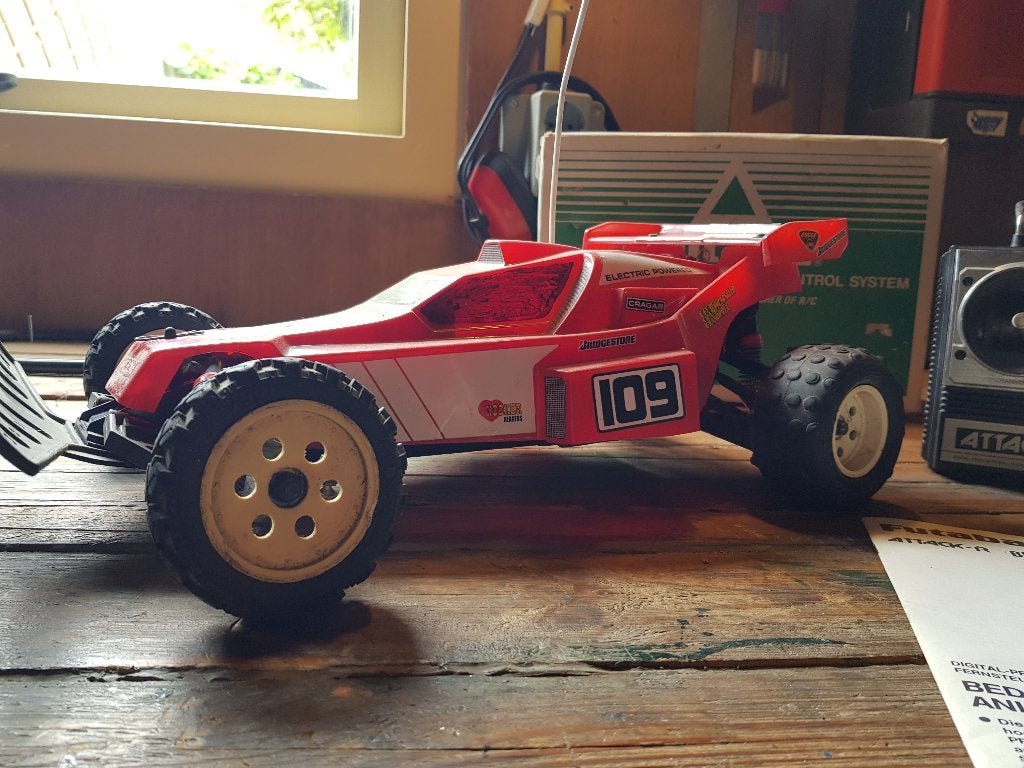 Kyosho Raider Vintage midmotor buggy met Robbe zender & ladr, Hobby en Vrije tijd, Elektro, Gebruikt, Auto offroad, Ophalen of Verzenden