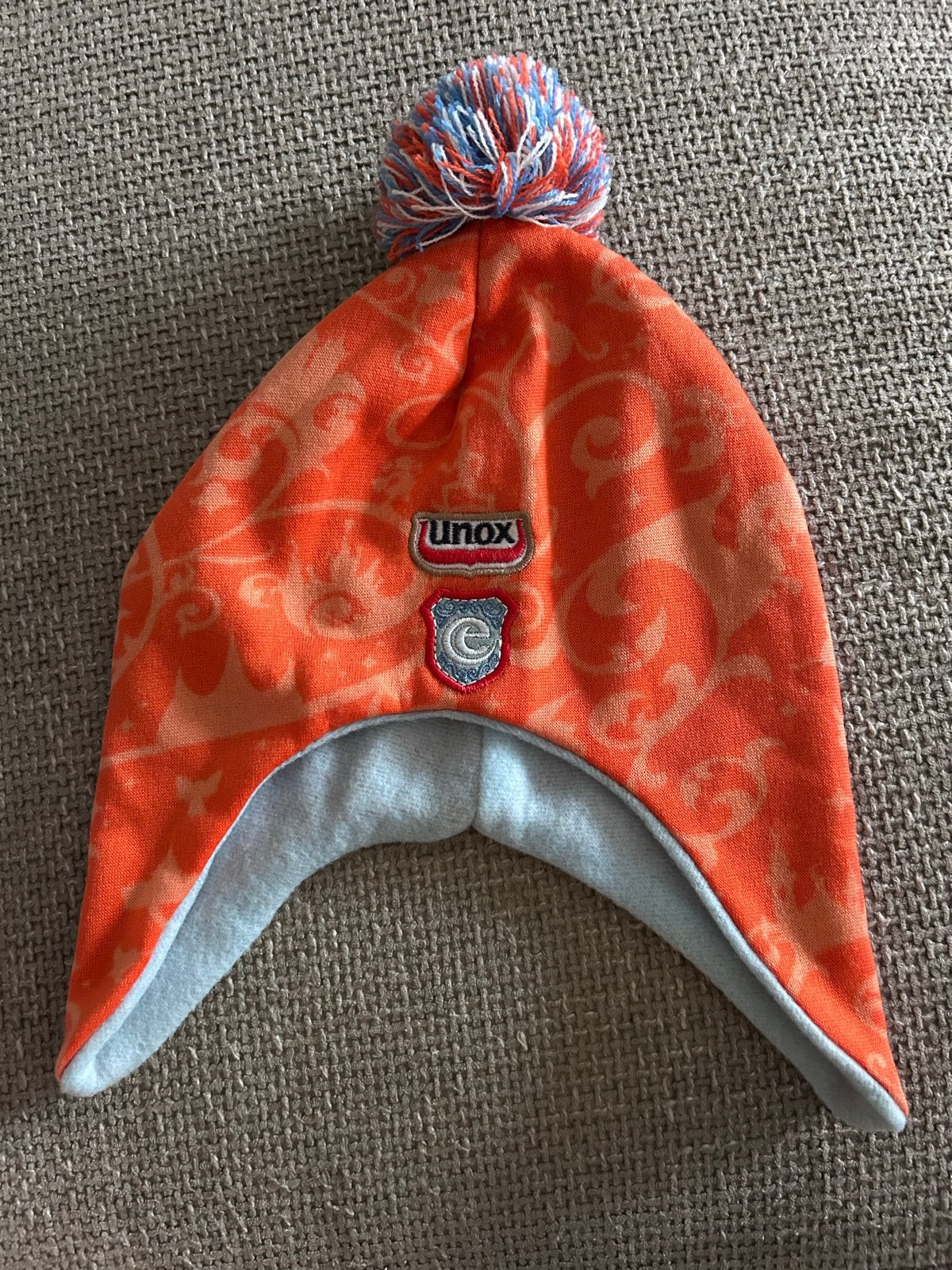 Unox Muts - Oranje met Pompon Efteling, Ophalen of Verzenden, Zo goed als nieuw
