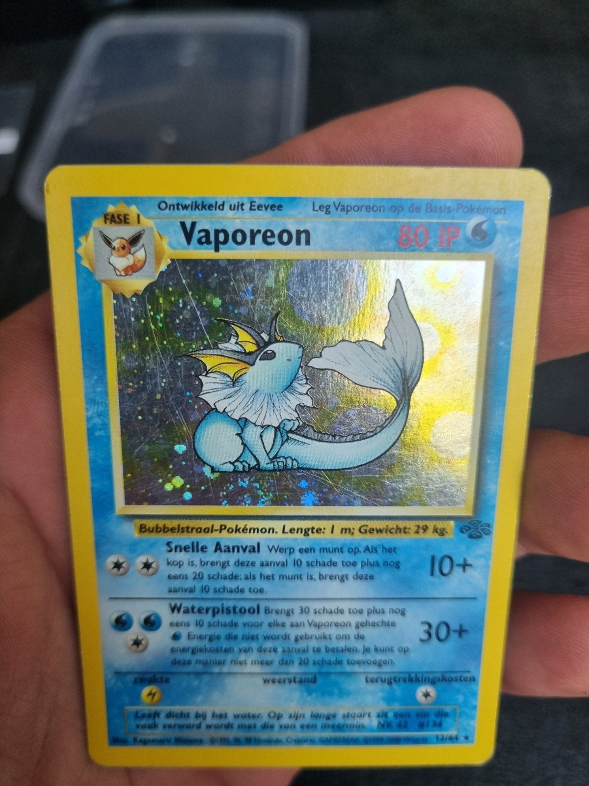 Vaporeon 12/64 Jungle NL , holo rare * € 15, Ophalen of Verzenden, Gebruikt, Losse kaart, Foil
