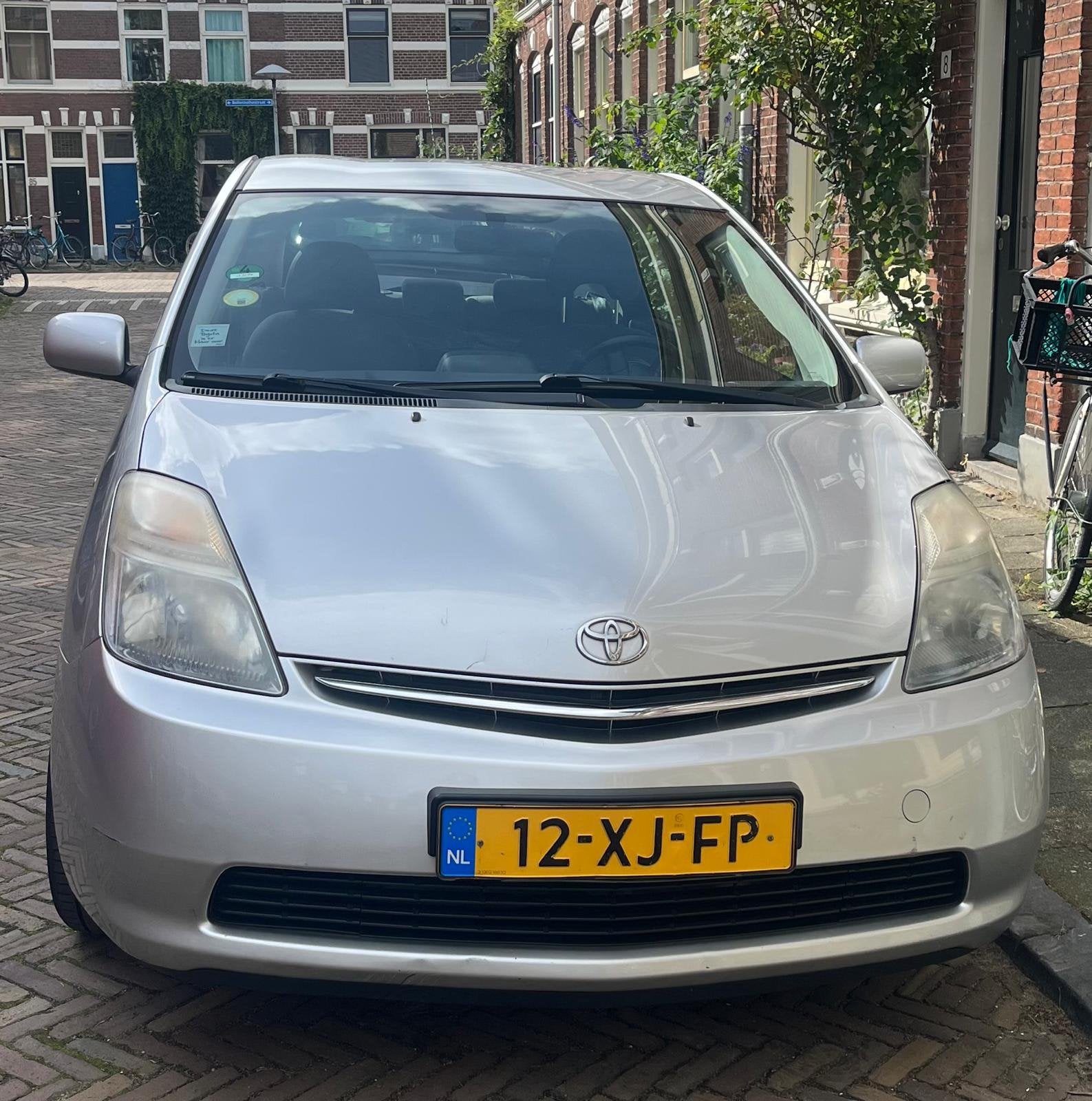 Toyota Prius 1.5 HSD 2007 Grijs, Auto's, 1497 cc, 4 cilinders, 23 km/l, Origineel Nederlands