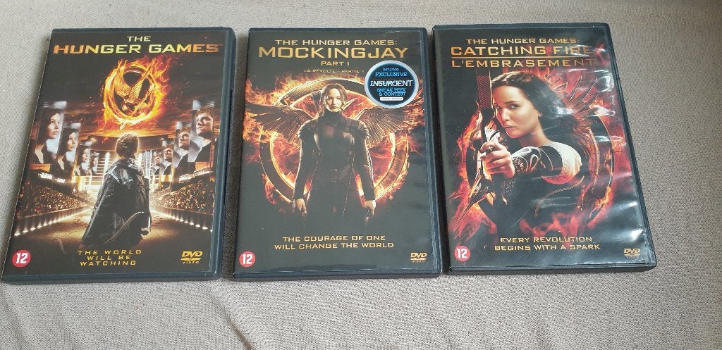 Te koop 3dvds Hunger games,  Mockingjay 1 ,catching fire, Engels, Nederlands, Actie, Ophalen of Verzenden