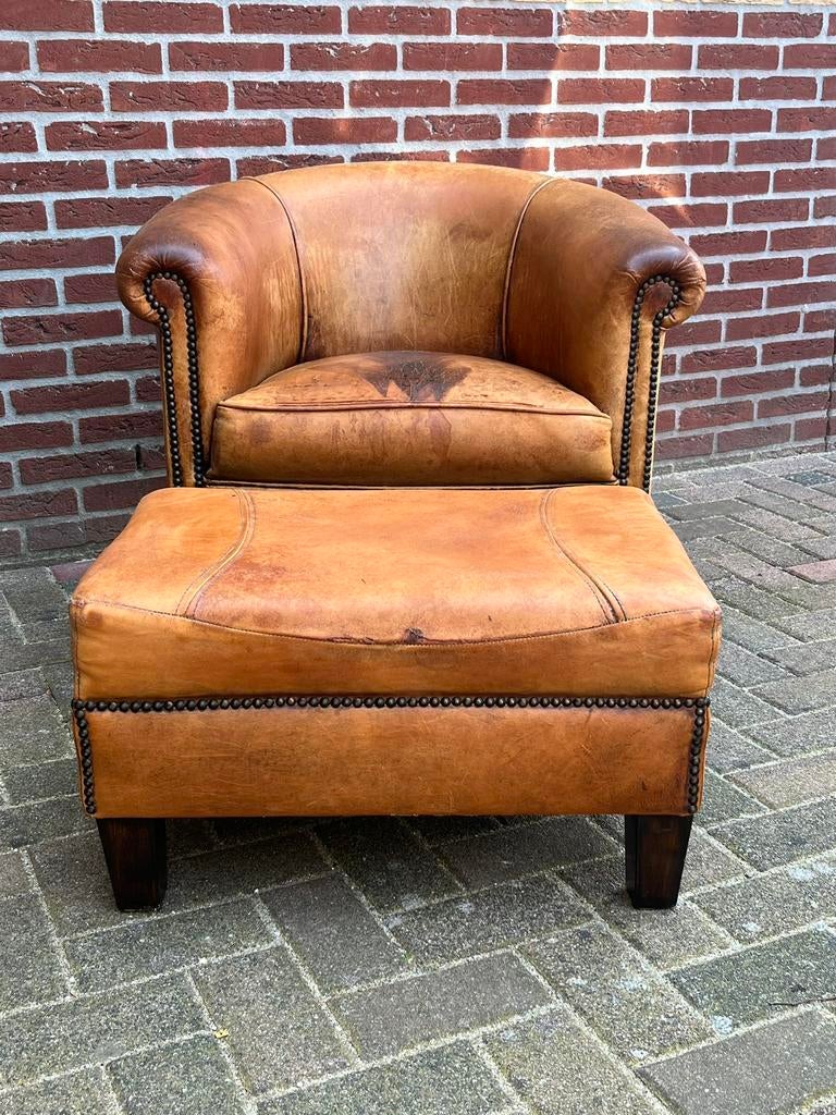 Schapenleren fauteuil met Hocker, Ophalen