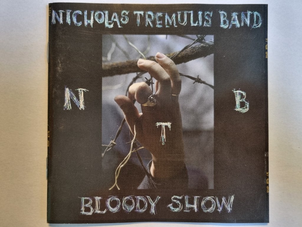 CD Nicholas Tremulis Band - Bloody Show (1996), Inclusief boekje, Gebruikt, Ophalen of Verzenden, Poprock