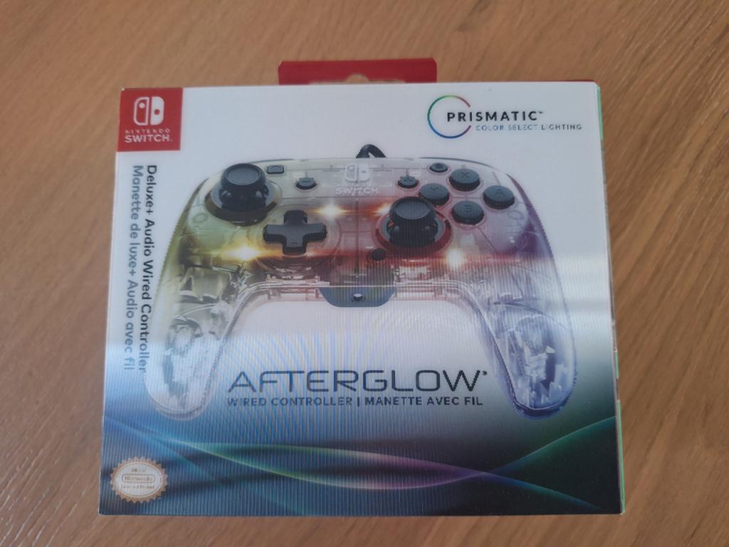 De Nintendo switch afterglow controller, Ophalen of Verzenden, Zo goed als nieuw, Met 1 controller, Switch Original