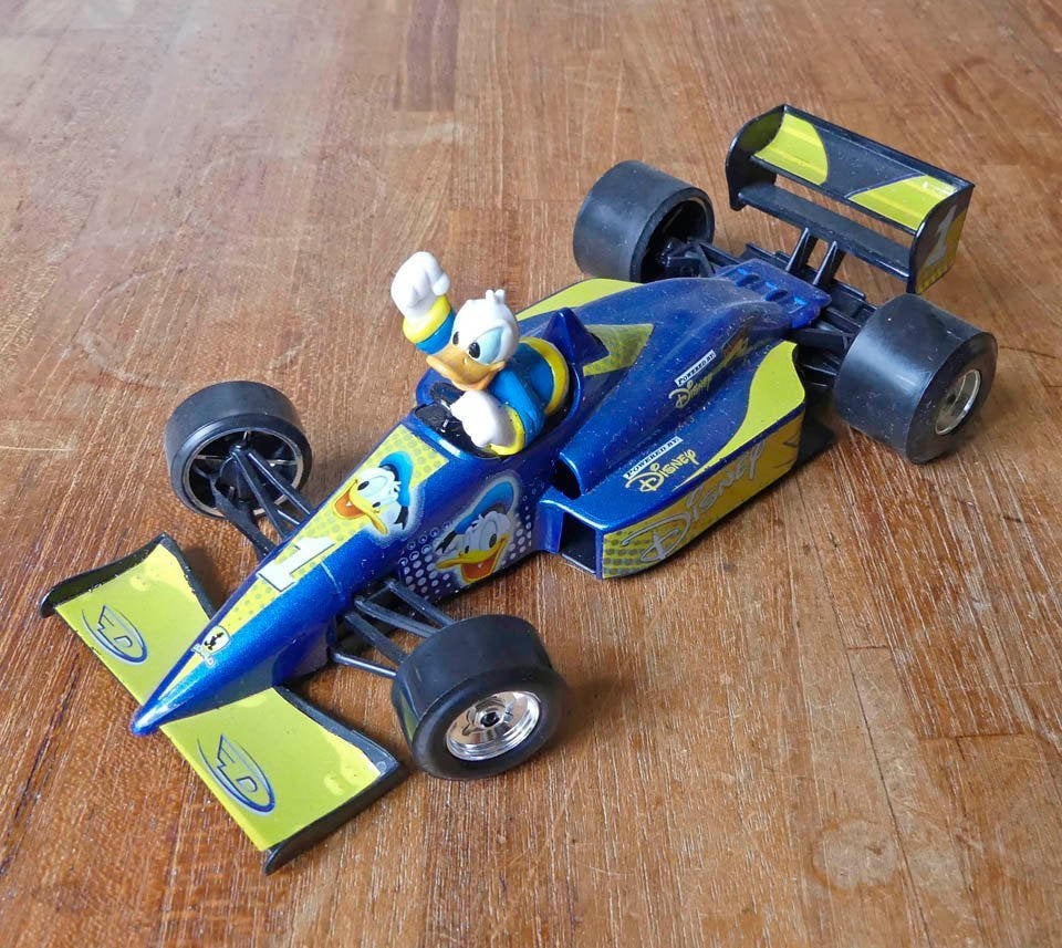 Bburago Formule 1 raceauto Donald Duck Walt Disney RacingF1, Ophalen of Verzenden, Gebruikt, Auto, Bburago