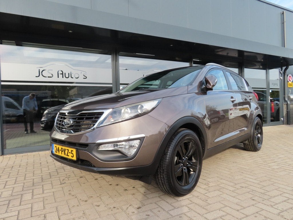 Kia SPORTAGE 2.0 X-ECUTIVE Plus Ecc Cruise Pano Trekhaak 201, Auto's, 13 km/l, Gebruikt, 4 cilinders, Bruin