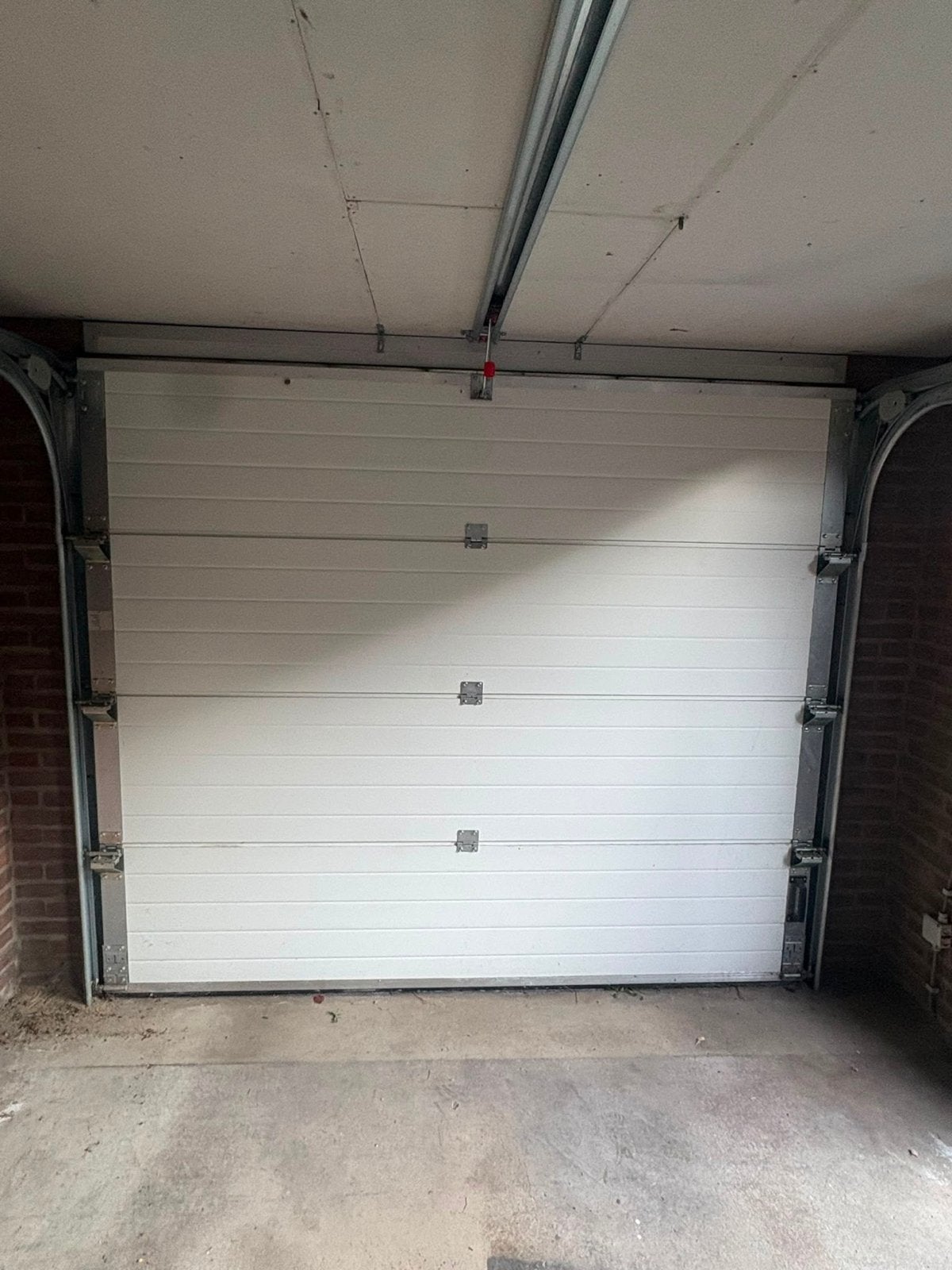 Garagedeur met elektrische opener, Ophalen