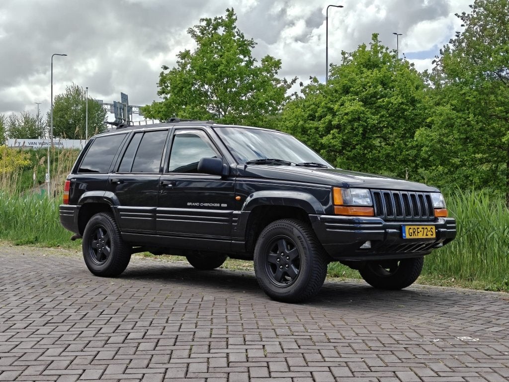 1998 Jeep Grand Cherokee 5.2 V8 LPG 4x4, Auto's, Automaat, 5216 cc, Zwart, Leder