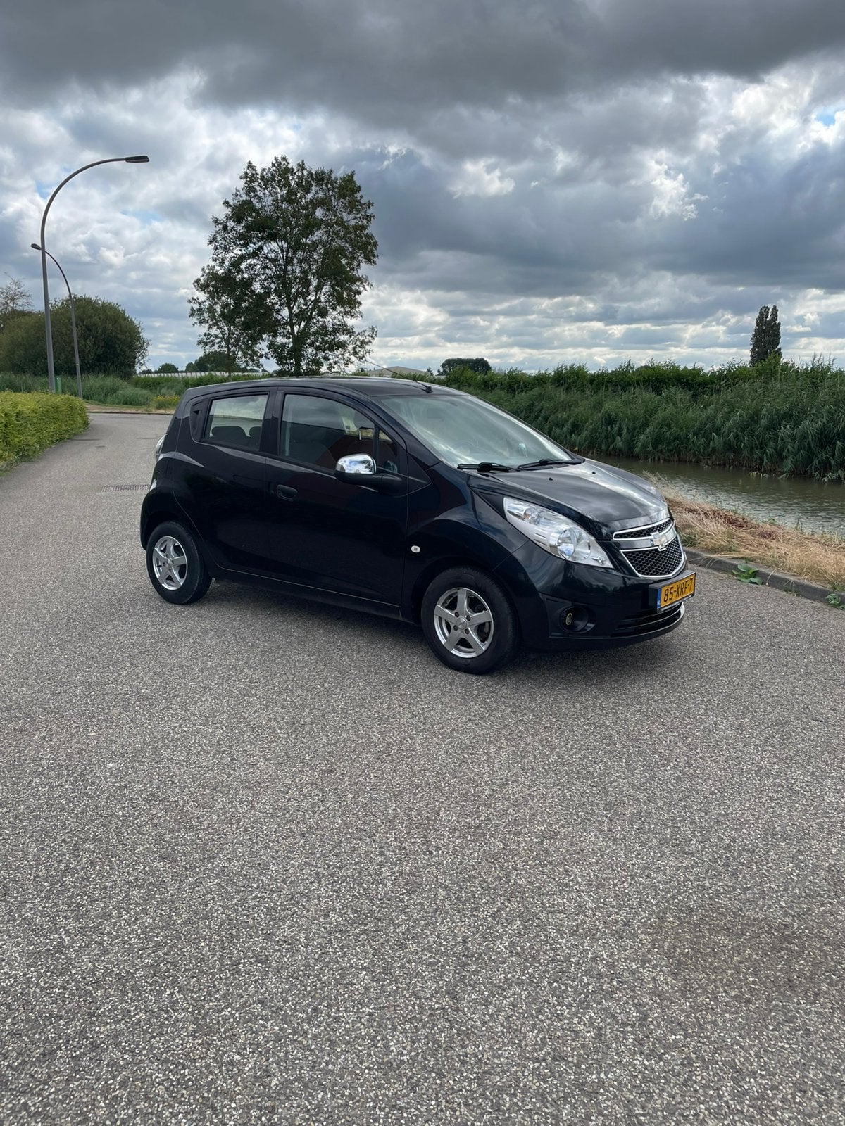 Chevrolet Spark 1.0 Bifuel 2012 Zwart, Auto's, Chevrolet, 37 €/maand, Zwart, 4 cilinders, Metallic lak