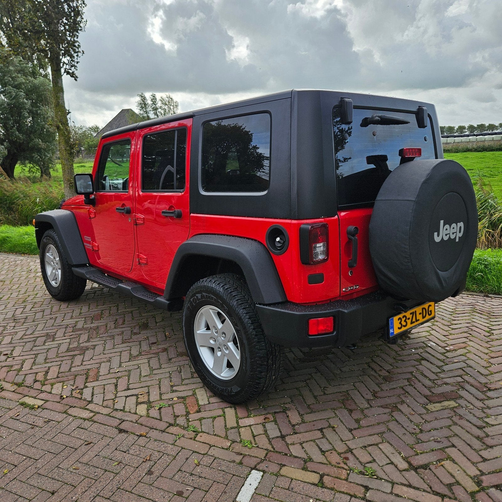 Jeep Wrangler 2.8 CRD Unlimited AUT 2008 Rood, Auto's, Automaat, Stof, 4 cilinders, 241 €/maand