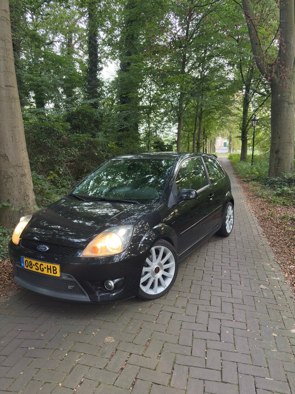 Ford Fiësta 2.0 16V ST 3DR 2006 Zwart, Auto's, Voorwielaandrijving, Zwart, 4 cilinders, Leder en Stof