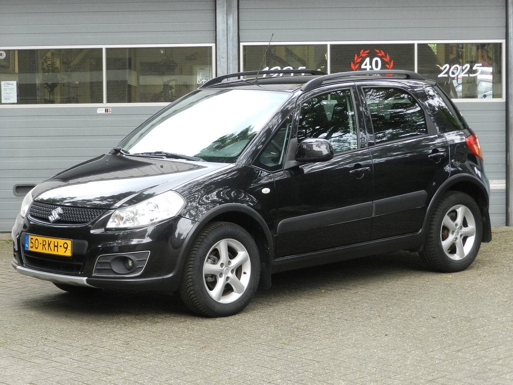 Suzuki SX4 1.6 AWD 4X4 Comfort 5Drs Airco Navigatie LMV Alca, Euro 5, Gebruikt, Zwart, 4 cilinders