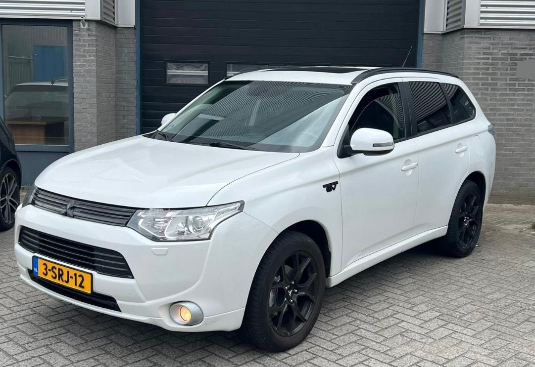 Mitsubishi Outlander PHEV 203PK 4WD Nieuw Panorama Leder, Auto's, 1998 cc, Outlander, 4 cilinders, Wit