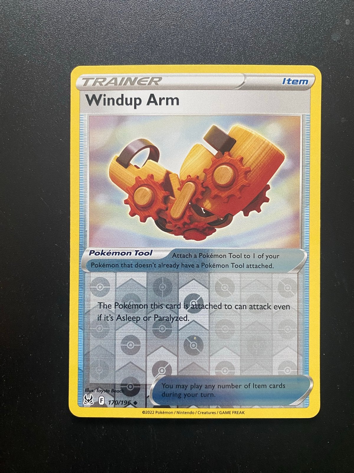 Windup Arm 170/196 Reverse Holo Pokémon Lost Origin, Ophalen of Verzenden, Zo goed als nieuw, Losse kaart, Foil