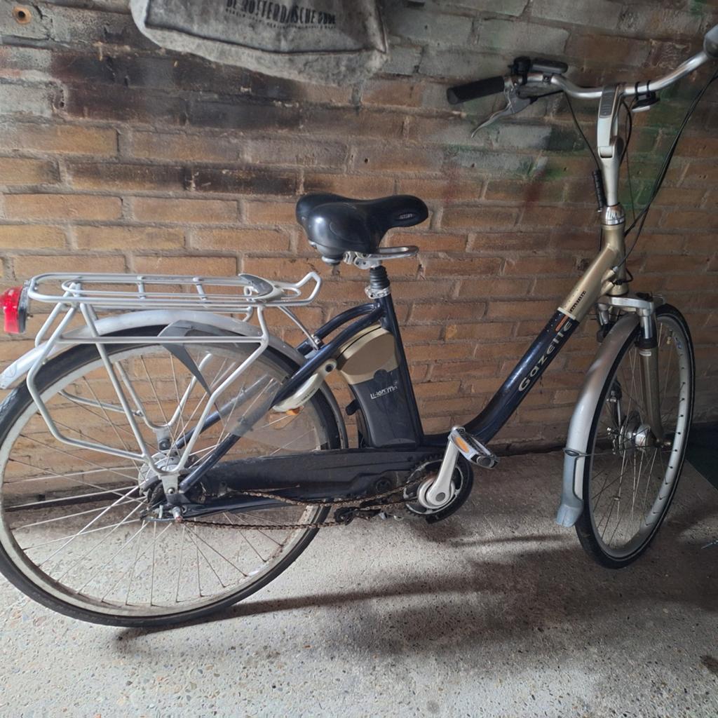 Elektrische fiets met 7 versnellingen en oplader, Ophalen of Verzenden, Gebruikt, Minder dan 30 km per accu, Overige merken