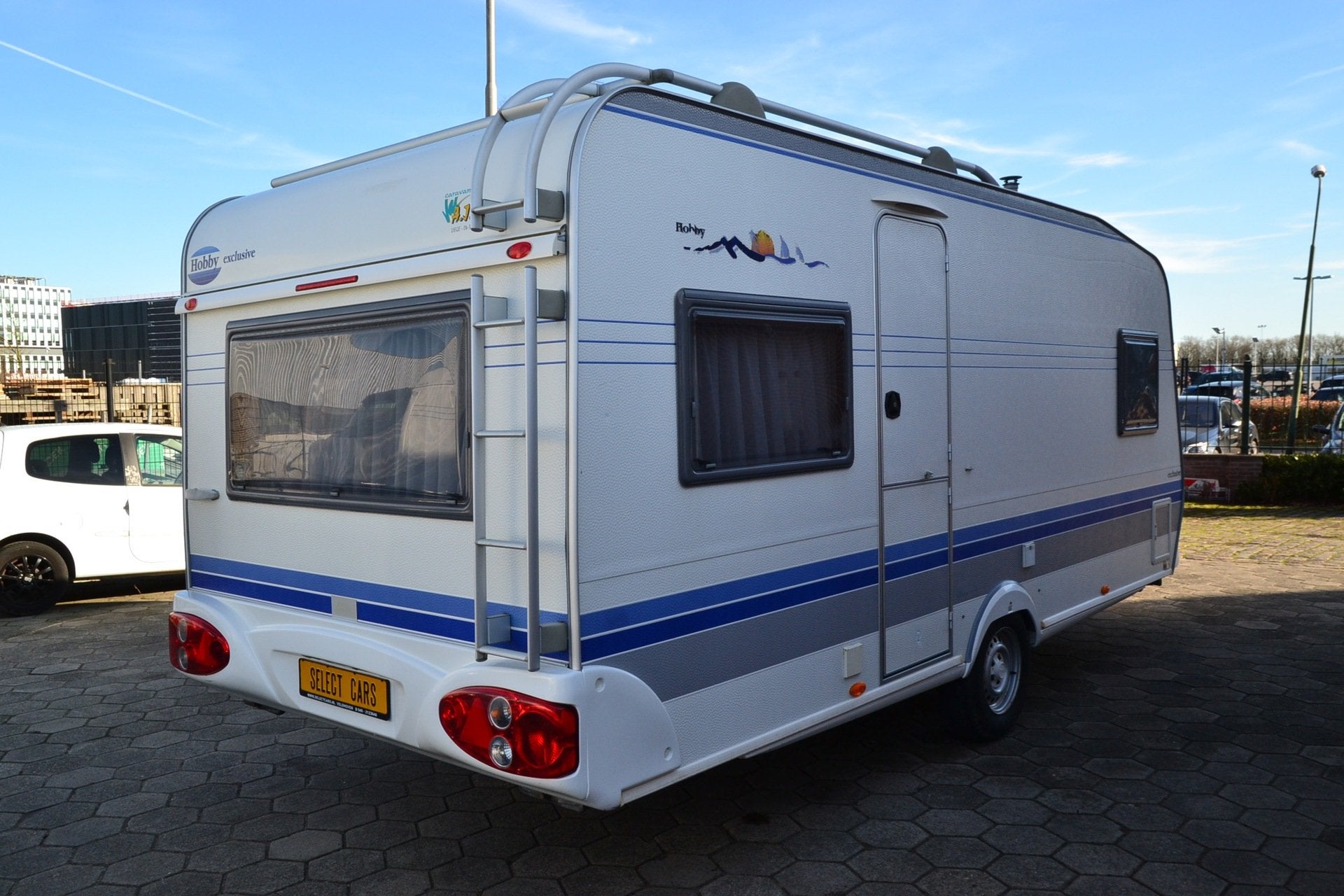 Hobby 495 B Exclusive - Frans bed - Wc+Douche - Voortent - G, Caravans en Kamperen, Vast bed, Schokbreker, Bedrijf, 4 tot 5 meter