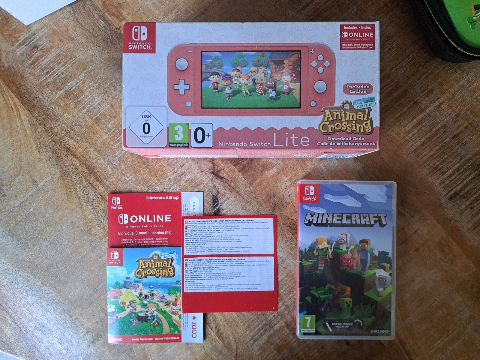 Nintendo Switch Lite Als Nieuw + Minecraft + Animal Crossing, Ophalen of Verzenden, Roze of Coral, Zo goed als nieuw, Met beschermhoes of tas