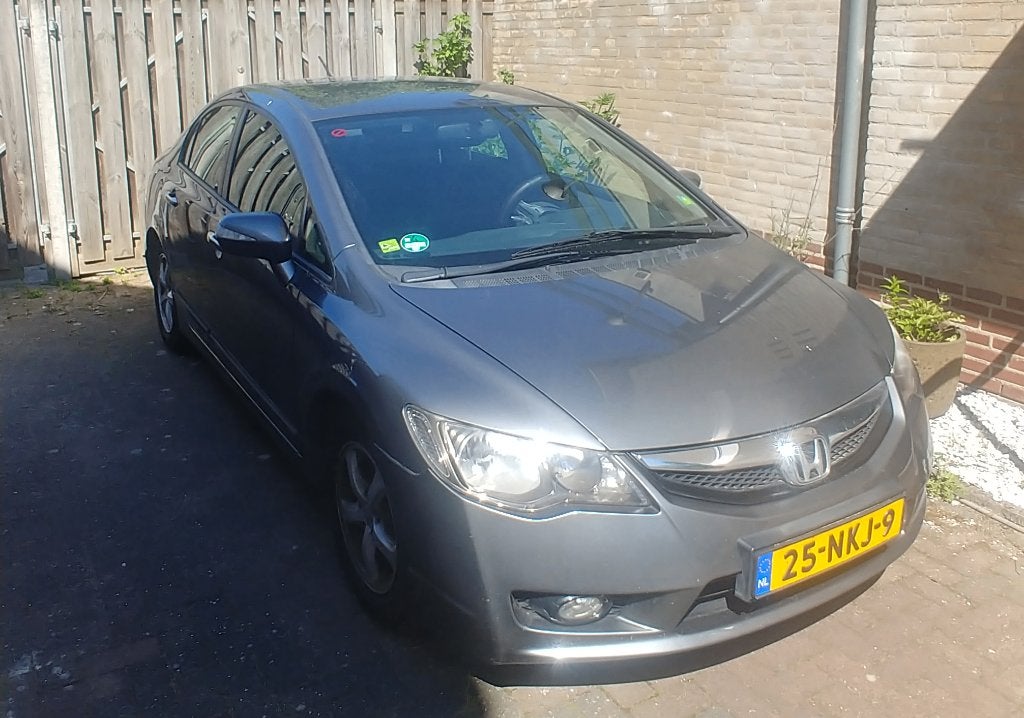 Honda Civic 1.3 95pk CVT 2010 Grijs, Stof, 1368 kg, Metallic lak, Origineel Nederlands