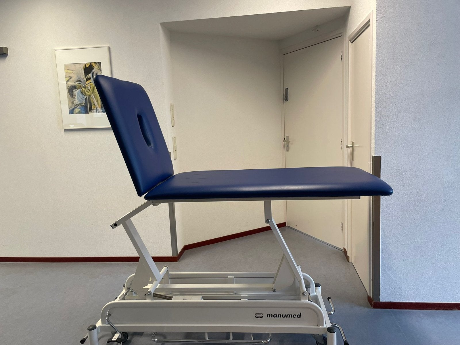 Manumed elektrische behandelbank van Enraf-Nonius, Sport en Fitness, Massageproducten, Ophalen, Gebruikt, Massagetafel