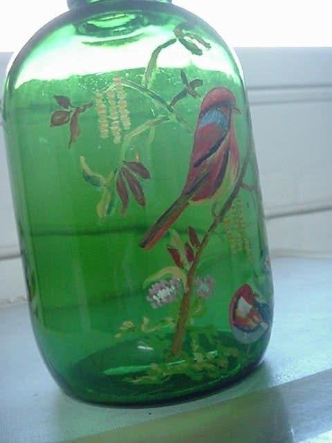 en Spaanse ronde sherry fles, die met vogels beschilderd is., Ophalen of Verzenden
