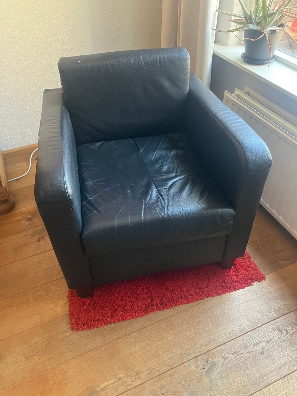 Zwart leren fateuil, Huis en Inrichting, Fauteuils, Ophalen, Zo goed als nieuw, Modern, 50 tot 75 cm