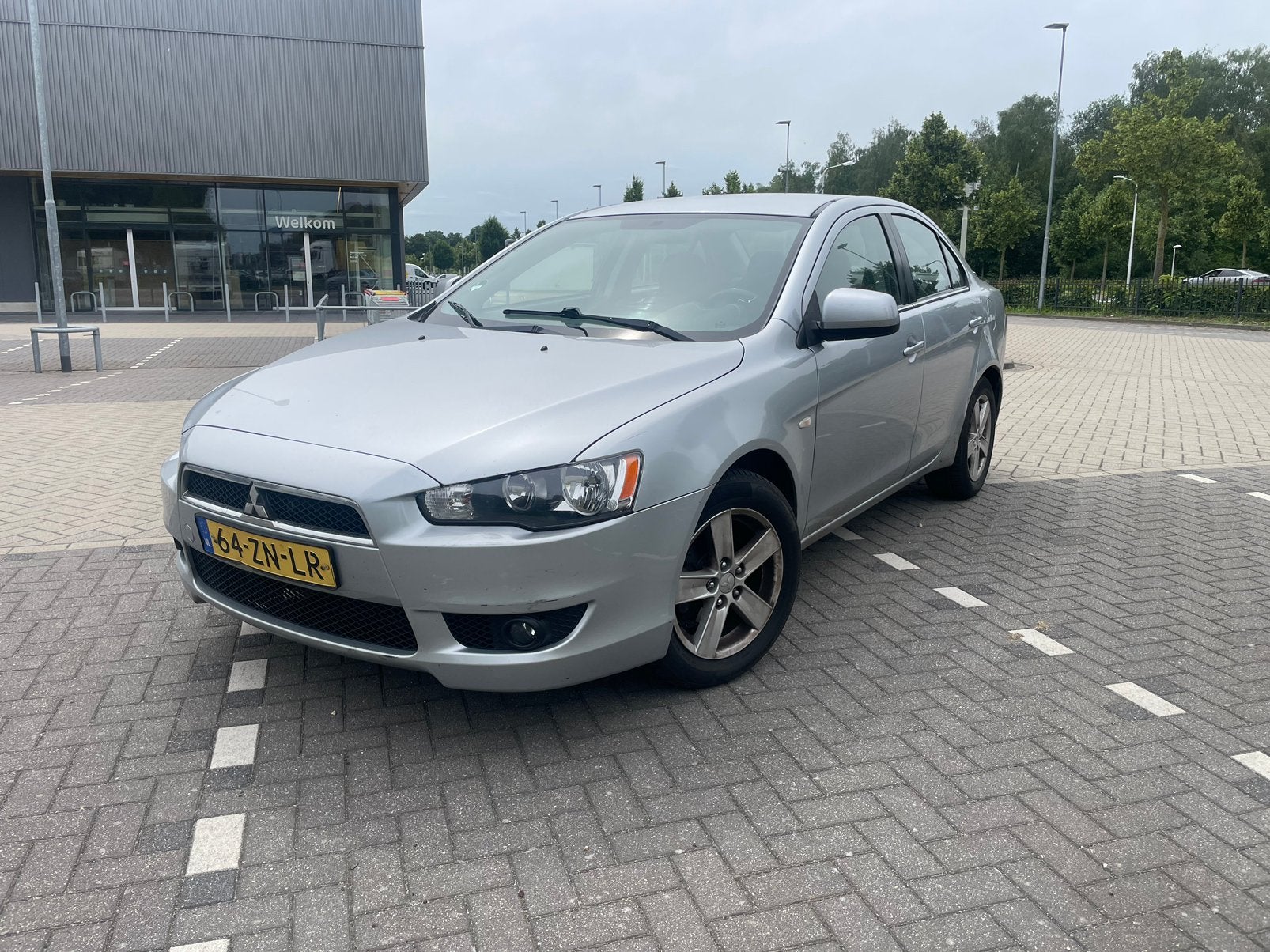 Mitsubishi Lancer 1.5 Mivec Sports Sedan 2008 Grijs, Auto's, Voorwielaandrijving, 4 cilinders, Origineel Nederlands, Bedrijf