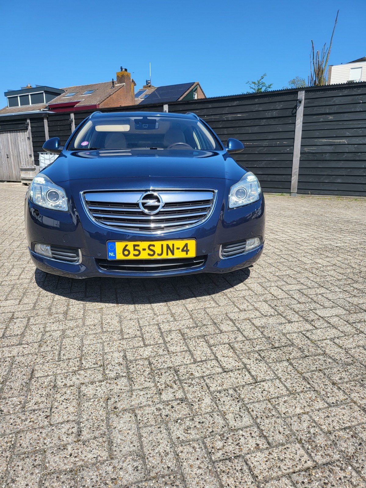 Opel Insignia 2.0 Turbo Sports Tourer 4X4 AUT 2010 Blauw, Auto's, Automaat, 1998 cc, 1800 kg, Beige