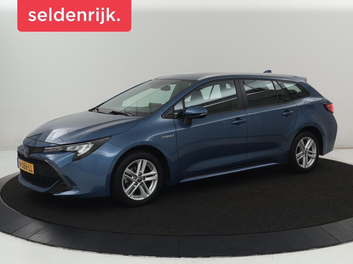 Toyota Corolla Touring Sports 1.8 Hybrid Business | Camera |, Auto's, Toyota, 1345 kg, Gebruikt, 4 cilinders, Blauw