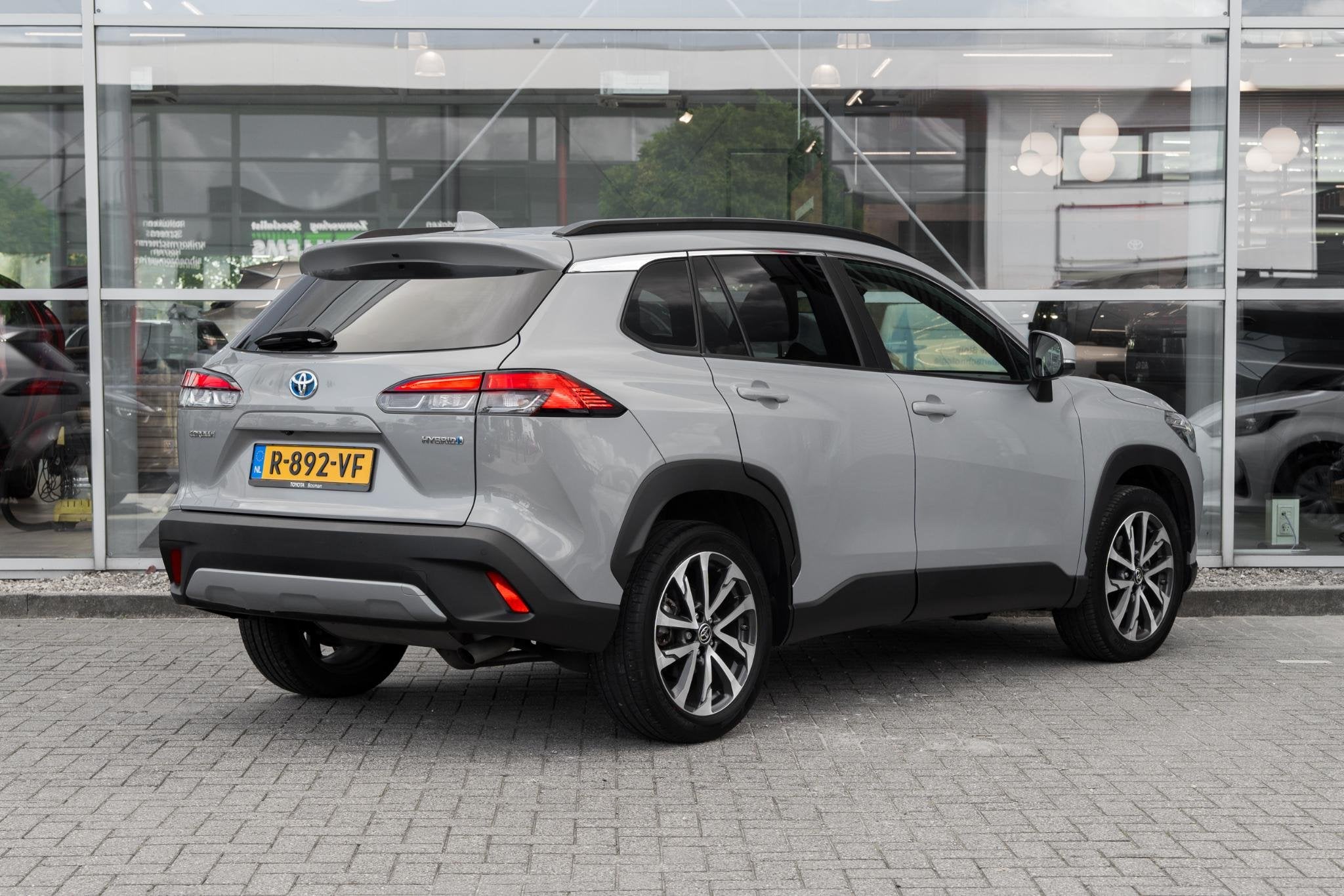 Toyota Corolla Cross 2.0 High Power Hybrid First Edition, Gebruikt, 4 cilinders, Leder en Stof, Origineel Nederlands