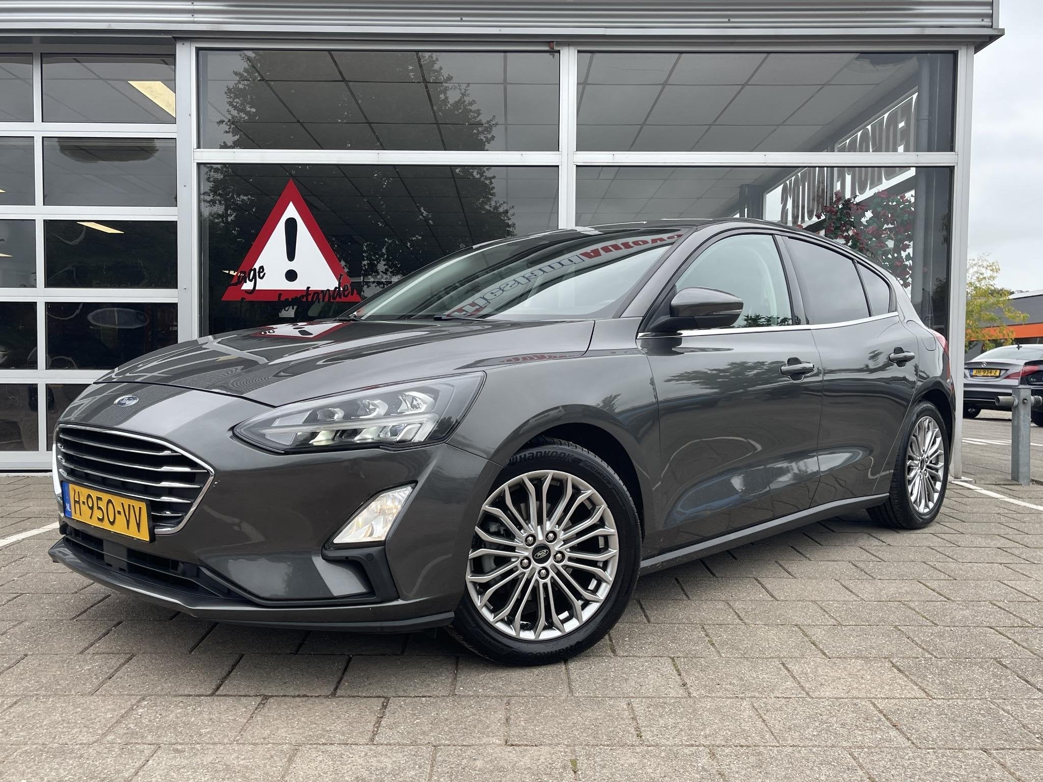 Ford Focus 1.0 EcoBoost Titanium Business /Cruise/Clima/Trek, Gebruikt, Euro 6, Met garantie (alle), Origineel Nederlands