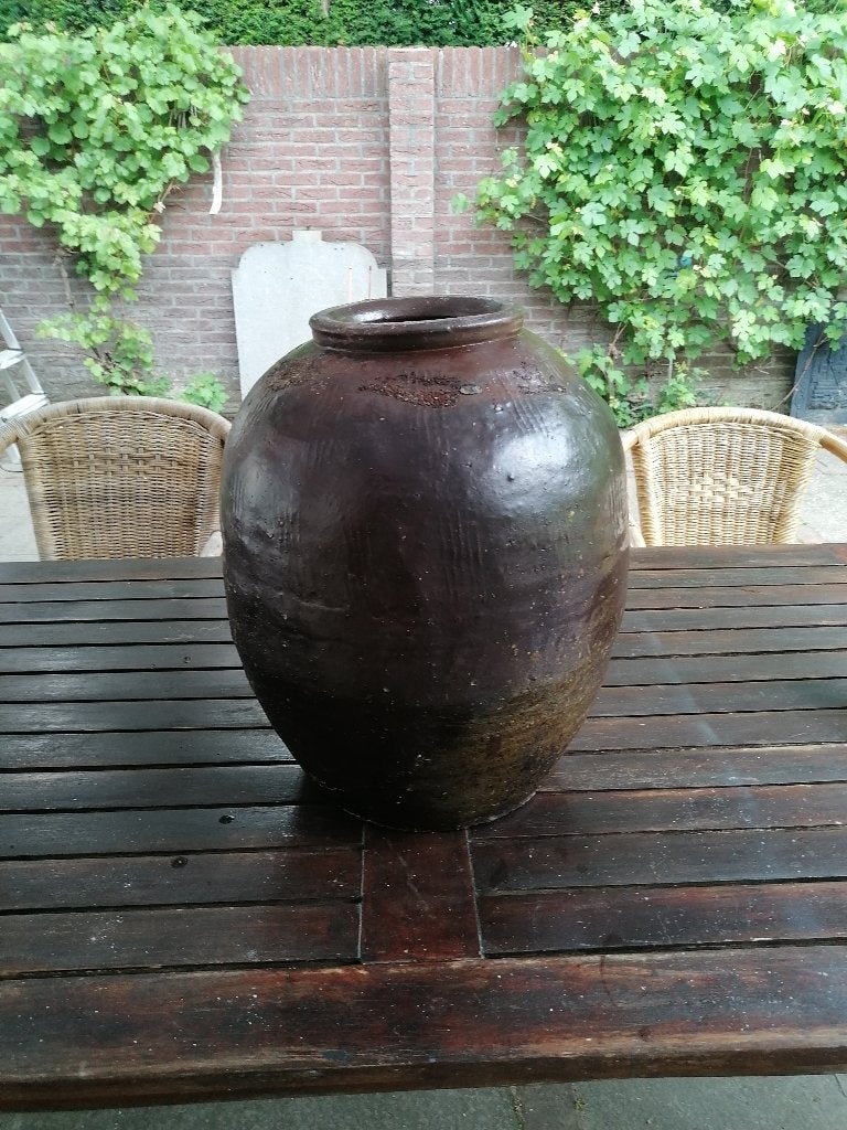Nepalese Antieke Kruik, Ophalen