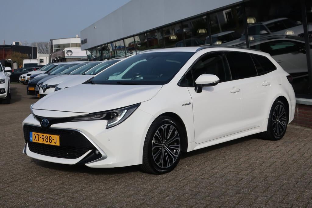 Toyota Corolla Touring Sports 1.8 Hybrid Executive LED_ADAP-, Auto's, Toyota, Gebruikt, 4 cilinders, Corolla, Wit